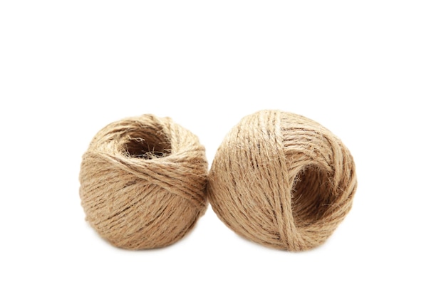 A balls of rope on a white background closeup Harness Jute Twine isolated