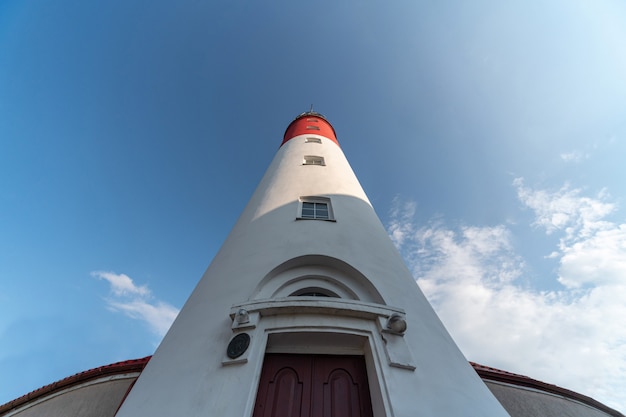 Baltic lighthouse, red white colors, bottom view. Most western russian lighthouse