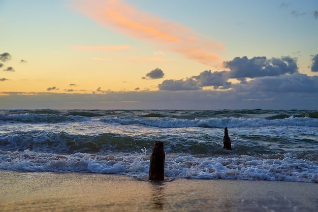 Baltic sea against dramatic cloudy sky at sunset