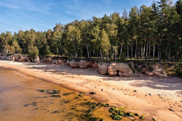 Baltic Sea coast with sandy beach and red sandstone cliffs Veczemju cliffs Latvia