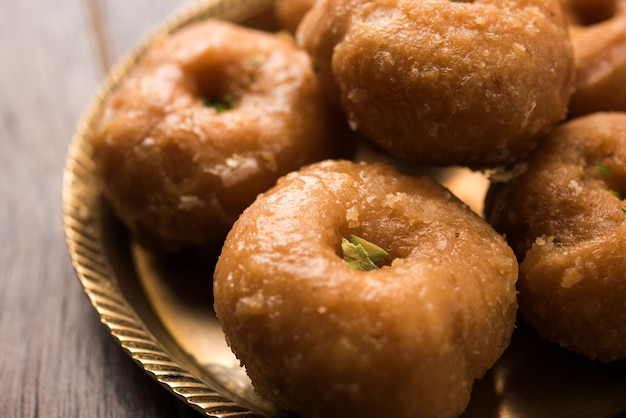 Balushahi sweet food served in a white or golden plate over moody background