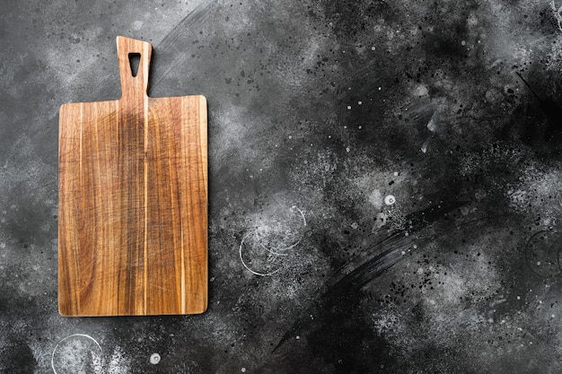 Bamboo cutting board set empty for empty for copy space for text or food, top view flat lay, on black dark stone table background