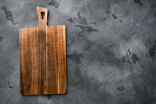 Bamboo cutting board set empty for empty for copy space for text or food, top view flat lay, on gray stone table background