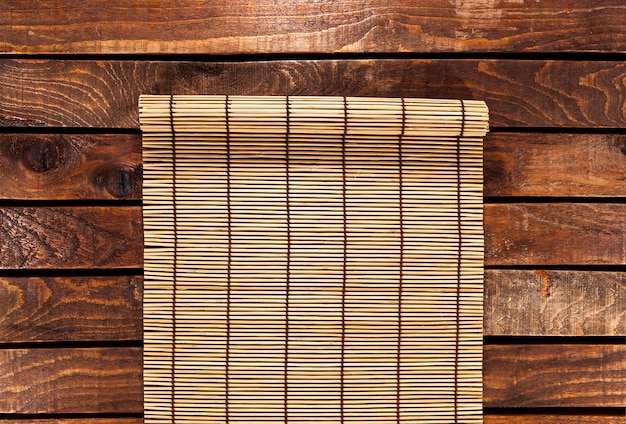 Photo bamboo mat on wooden table