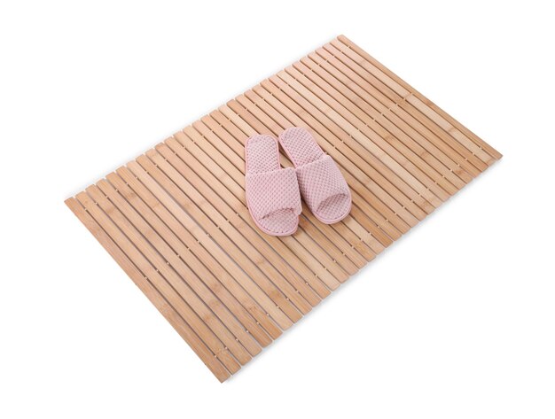 Bamboo rug with soft slippers isolated on white Bath accessory