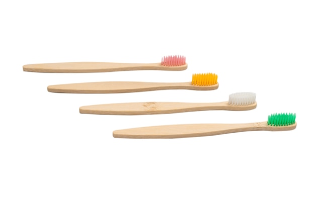 Bamboo toothbrush isolated on a white surface. Top view.