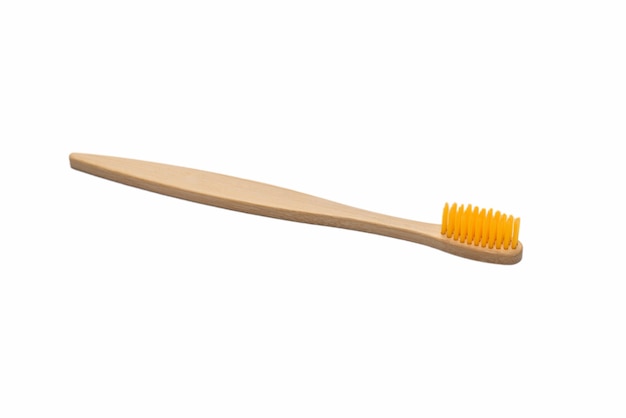 Bamboo toothbrush isolated on a white surface