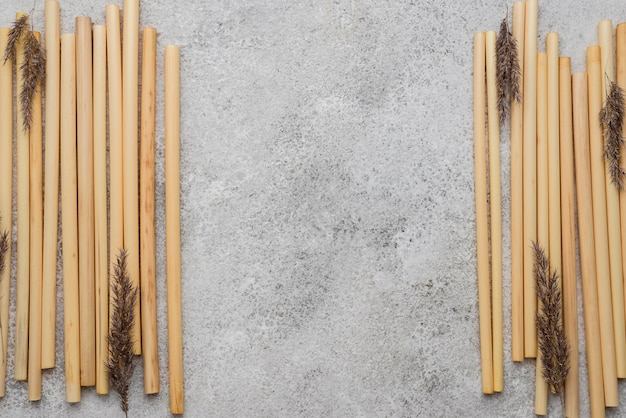 Bamboo tubes for drinking and lavender flat lay