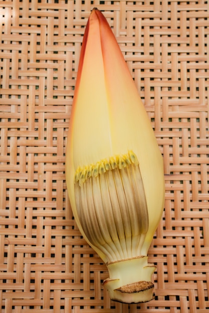 Banana blossom on bamboo tray.