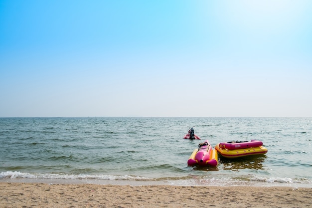 Banana boat and a rubber boat float with jet ski in the sea