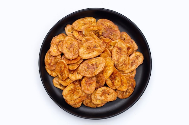 Banana chips on white background