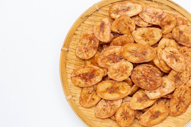 Banana chips on white background