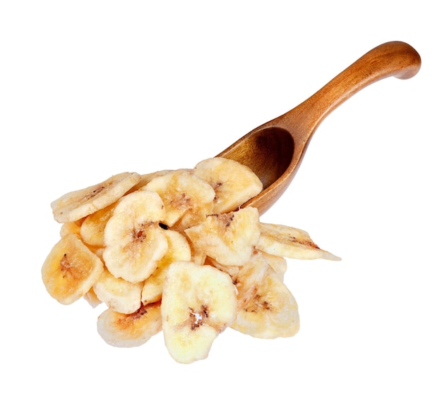 Banana chips in the wooden spoon isolated on white background