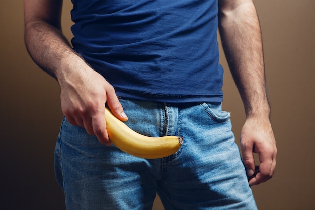 Banana male penis size concept on brown background