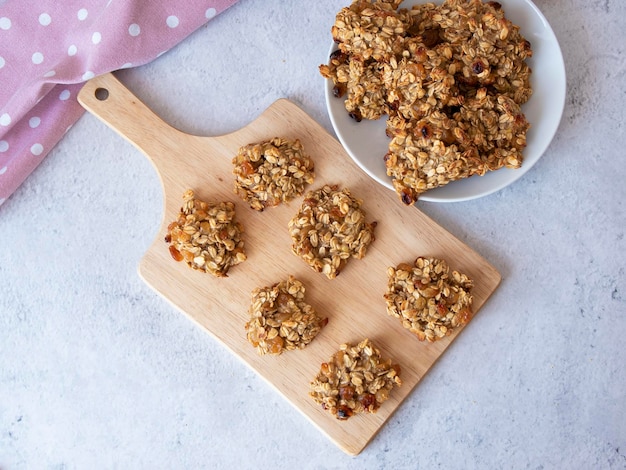 Banana and oatmeal cookies on the board View from above