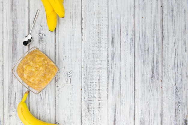 Banana Puree on wooden background