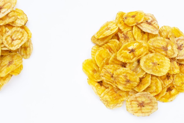 Banana slice chips on white background