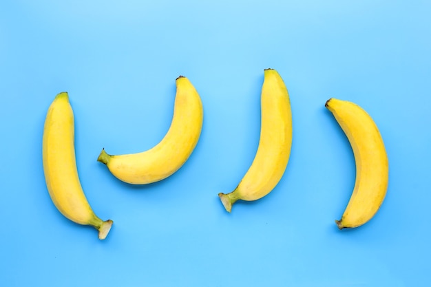 Bananas on blue surface. Top view