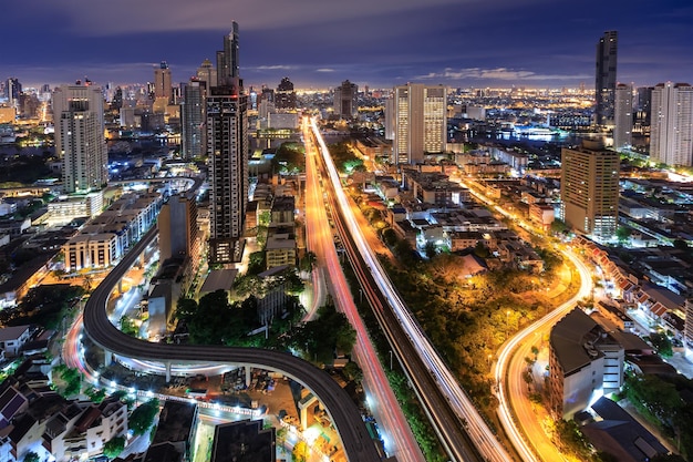 Bangkok business district city center above trident road and traffic with buildings and skyscrapers in morning