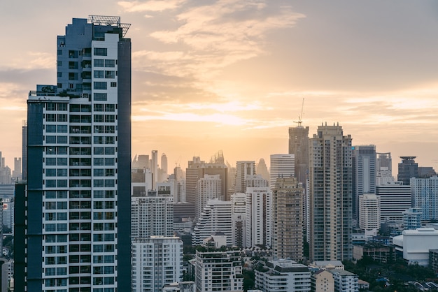 Bangkok cityscape after the rain in the evening with sun going down.