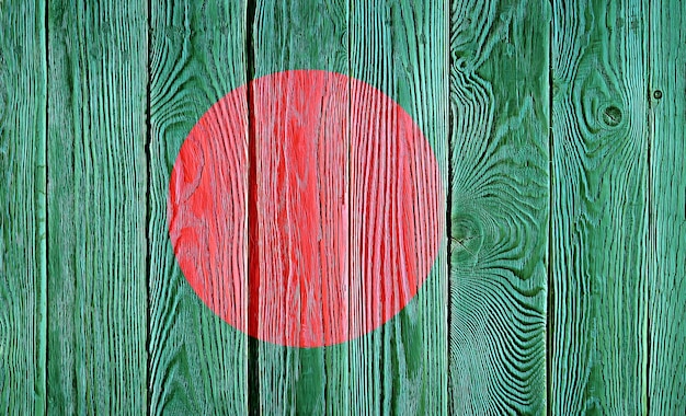 Bangladesh flag painted on old wood plank background Brushed natural light knotted wooden board texture Wooden texture background flag of Bangladesh