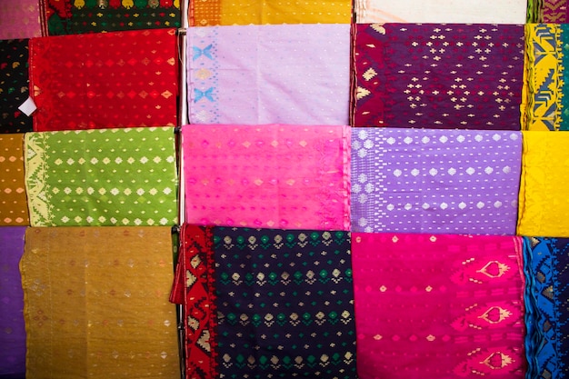 Bangladeshi  Traditional Colorful Jamdani saree hanging in the retail Showrooms