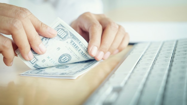 Bank employees are counting banknotes received or paid to customers.