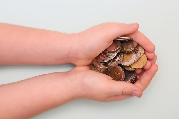 Banknotes and coins on the table and in the hands