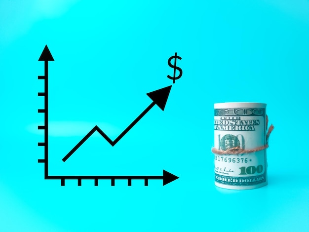 Photo banknotes and graph growing up on blue background movement growth and progress concept