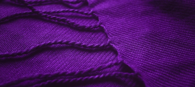 Banner of fabric texture background of purple color (Very Peri). Close up of clothes as wallpaper.