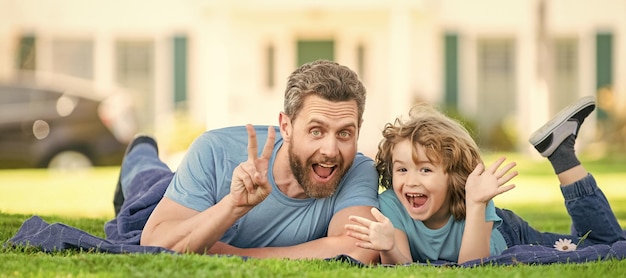 Banner of father and son in summer park outdoor childhood and parenthood parent relax with little