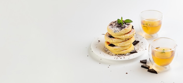 Banner, gluten-free cheese cakes on coconut flour with chocolate and green tea, on a white background