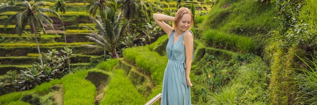 Banner long format beautiful young woman walk at typical asian hillside with rice farming mountain