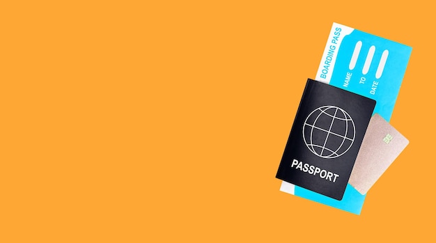 Banner for plane travel ads with copy space for text Abstract global passport Id document air ticket and bank card on orange background