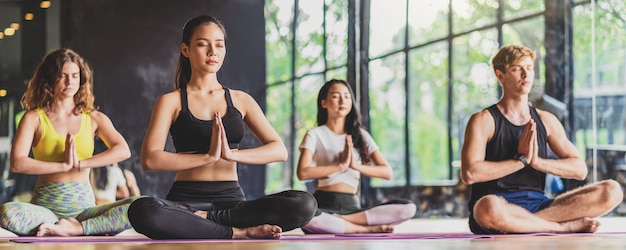 Banner, web page or cover template of Group of diversity practicing yoga class