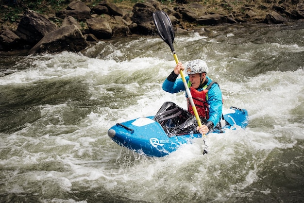 Banner whitewater kayaking extreme sport rafting Guy in kayak sails mountain river