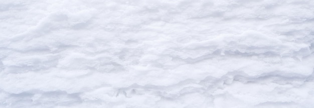 Banner winter snow snow texture top view of the snow texture for design snowy white texture snowflakes