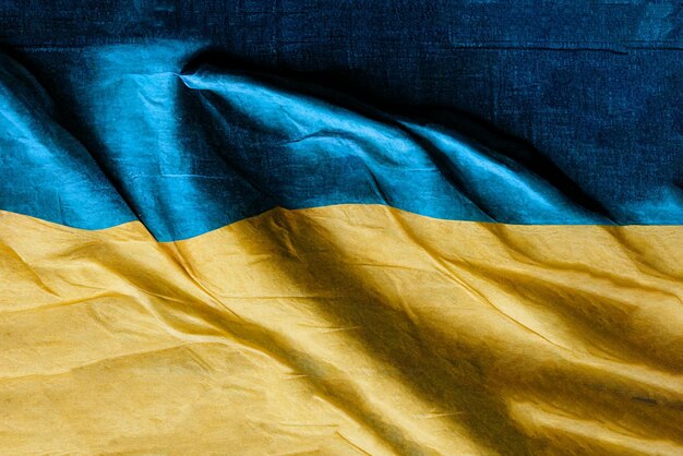 Banner with background of waving flag of Ukraine with sky texture over it National symbol