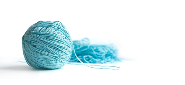 Banner with space for text The subject of needlework A ball of blue half wound fine cotton yar