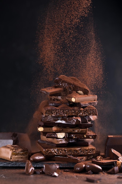 Bar of chocolate tower pieces hazelnut and almond dark chunks of broken chocolate