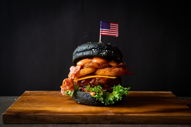 Barbecue burger pork with barbecue sauce with cheese onion rings and bacon burger