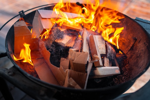 Barbecue grill with fire on open air close up