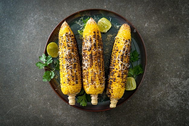 Barbecue and grilled corn with cheese and lime