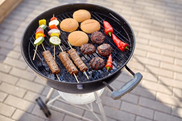 barbecue kebab meat and vegetables on grill