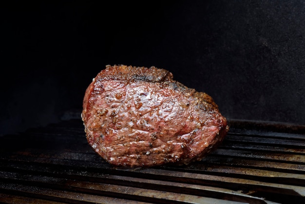 Barbecue of picanha, Brazilian exclusive meat court, on the grill