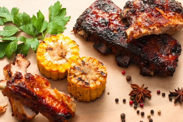 Barbecue spare ribs with corn on wooden tray