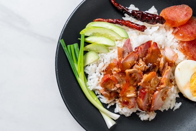 Barbecued red pork in sauce on topped rice