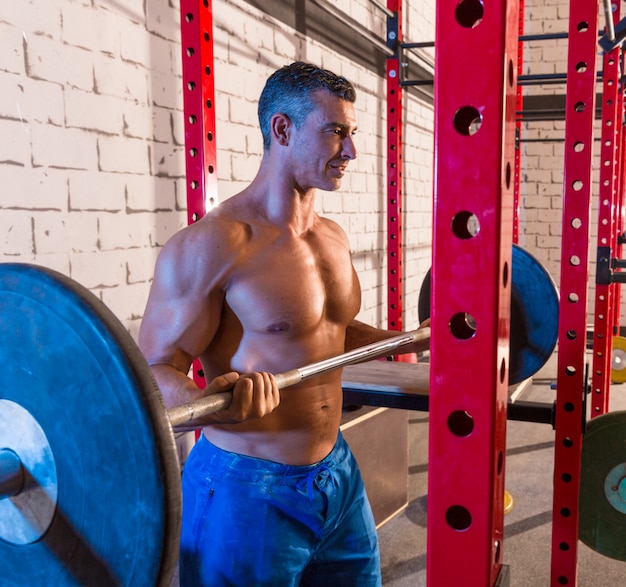 Photo barbell weight lifting man weightlifting at gym