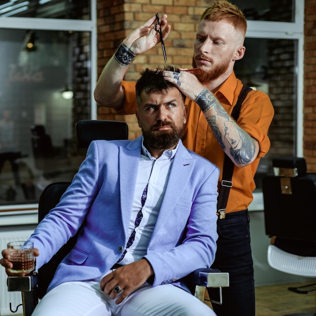 Barber scissors and straight razor razor sharp barber shop studios bearded man getting haircut by ha