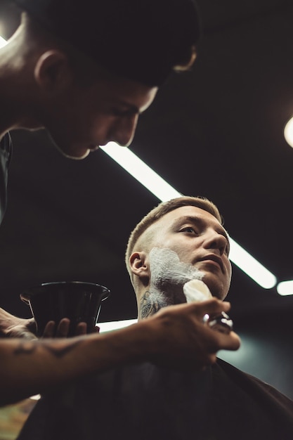 Barber shaving client